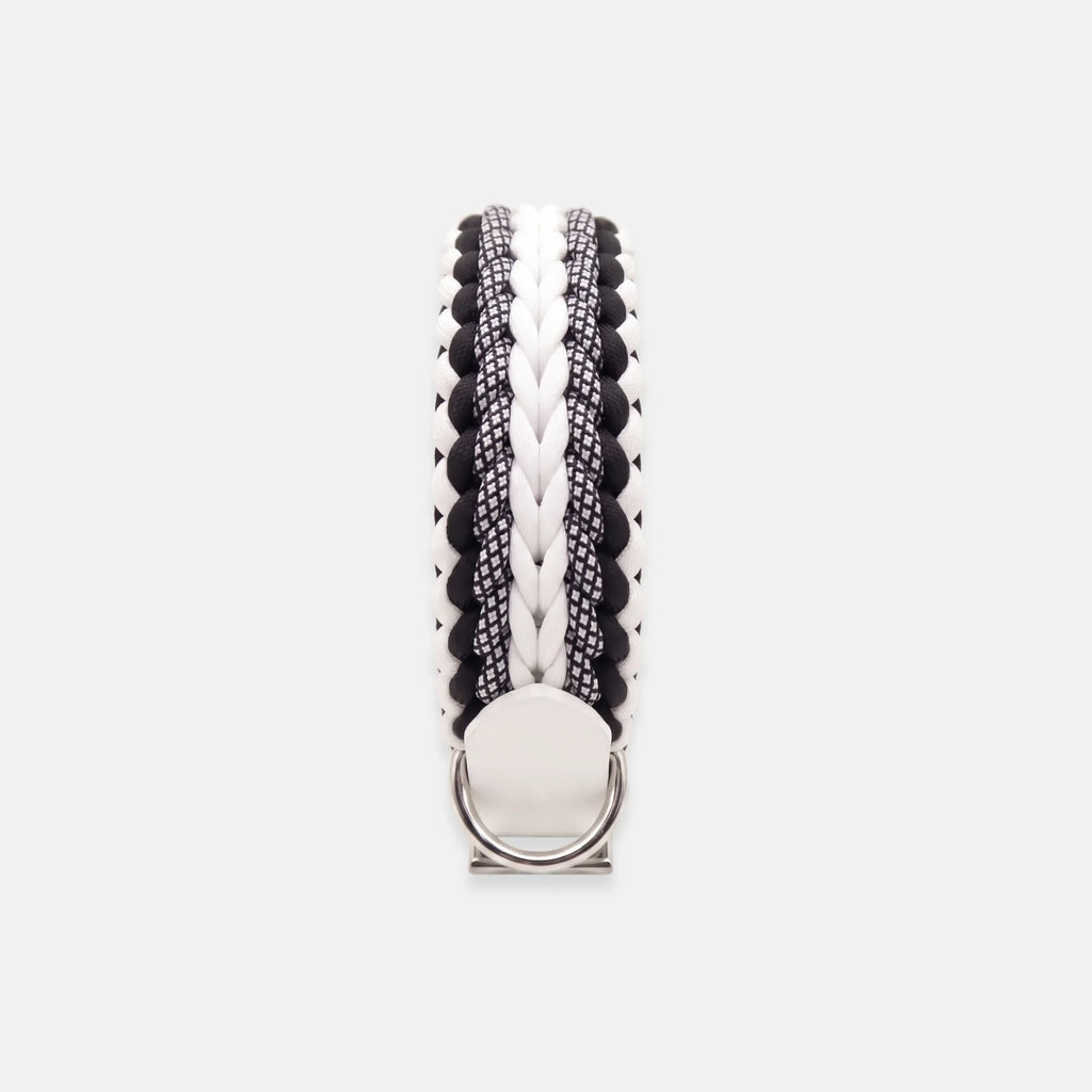 Handmade Strata braided dog collar in Onyx, featuring black and white paracord with an adjustable vegan leather strap by Jamie Dogwear.