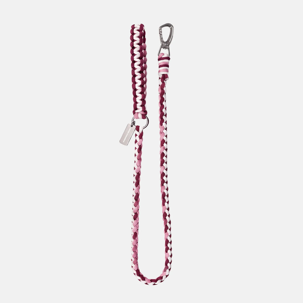 Handmade Strata braided dog lead in Dahlia, featuring pink, burgundy and white paracord by Jamie Dogwear.
